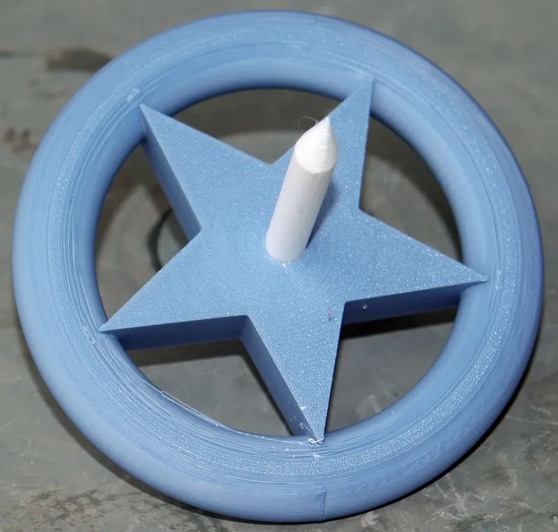 Kreisel mit Stern und Donut Design